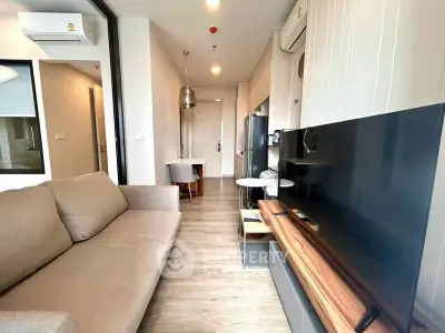 Modern living room with sleek furniture and open layout in a stylish apartment.