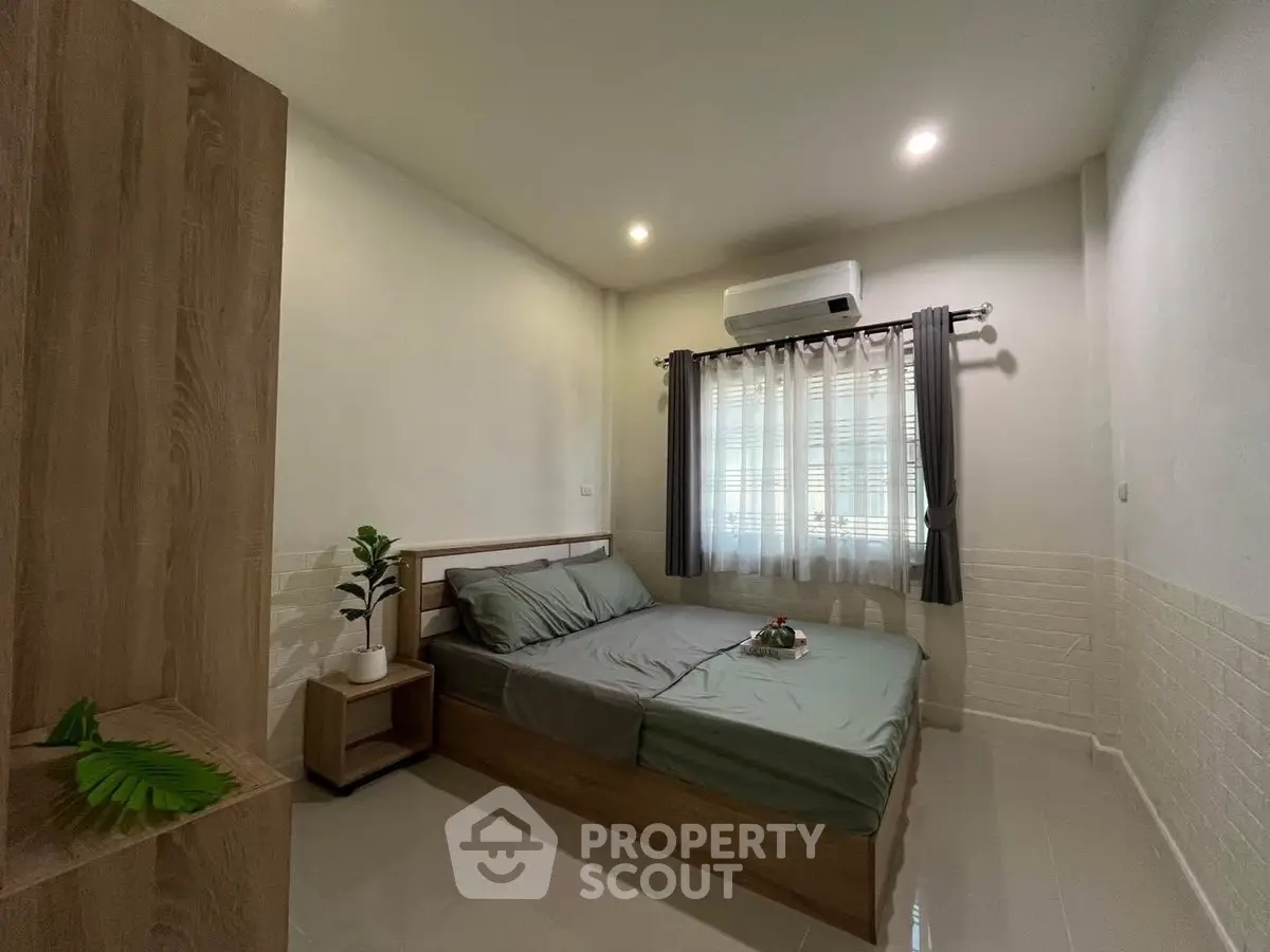 Cozy bedroom with modern decor and natural light