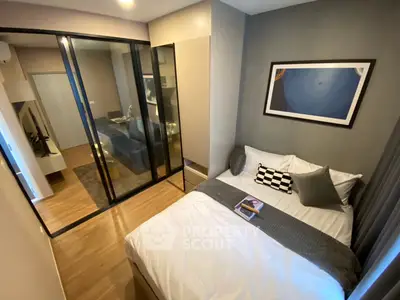 Modern bedroom with glass partition and stylish decor in a cozy apartment