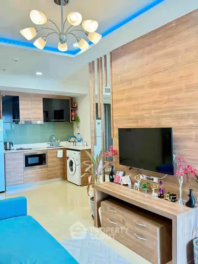 Modern living room with open kitchen, stylish wood paneling, and contemporary lighting.