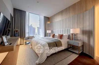 Luxurious bedroom with city view, elegant decor, and modern furnishings in a high-rise apartment.
