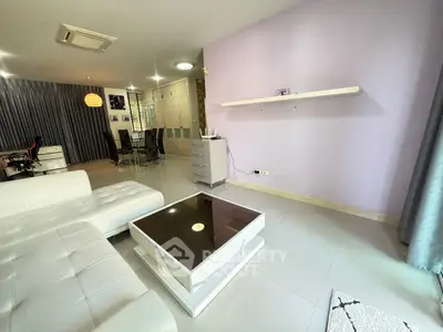 Spacious modern living room with sleek furniture and elegant decor