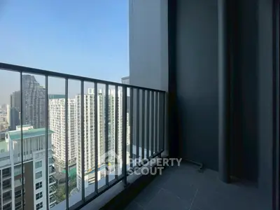 Modern high-rise balcony with stunning cityscape view, perfect for urban living enthusiasts.