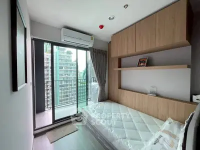 Modern bedroom with balcony view in high-rise apartment