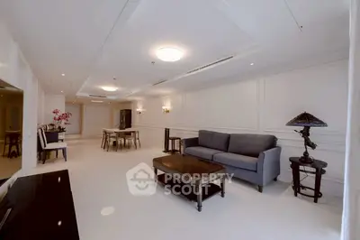 Elegant living room with modern furniture and stylish decor in a spacious open layout.