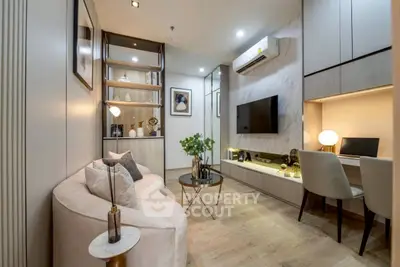 Modern living room with stylish decor, cozy seating, and built-in workspace