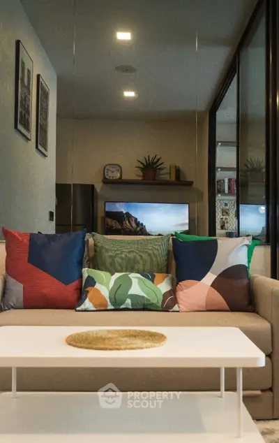 Stylish living room with modern decor and vibrant cushions