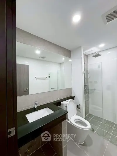 Modern bathroom with sleek design and glass shower enclosure