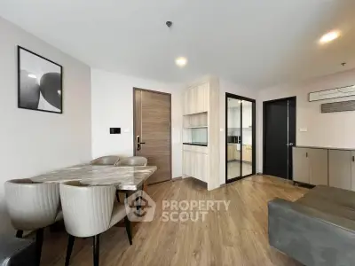 Modern living room with dining area and open kitchen in stylish apartment