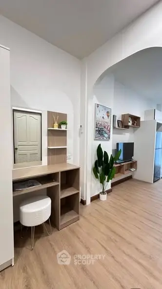Modern living space with stylish decor and wooden flooring