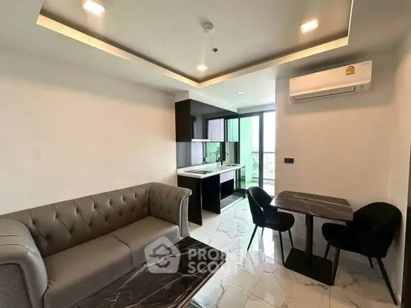 Modern living room with sleek furniture and open kitchen layout