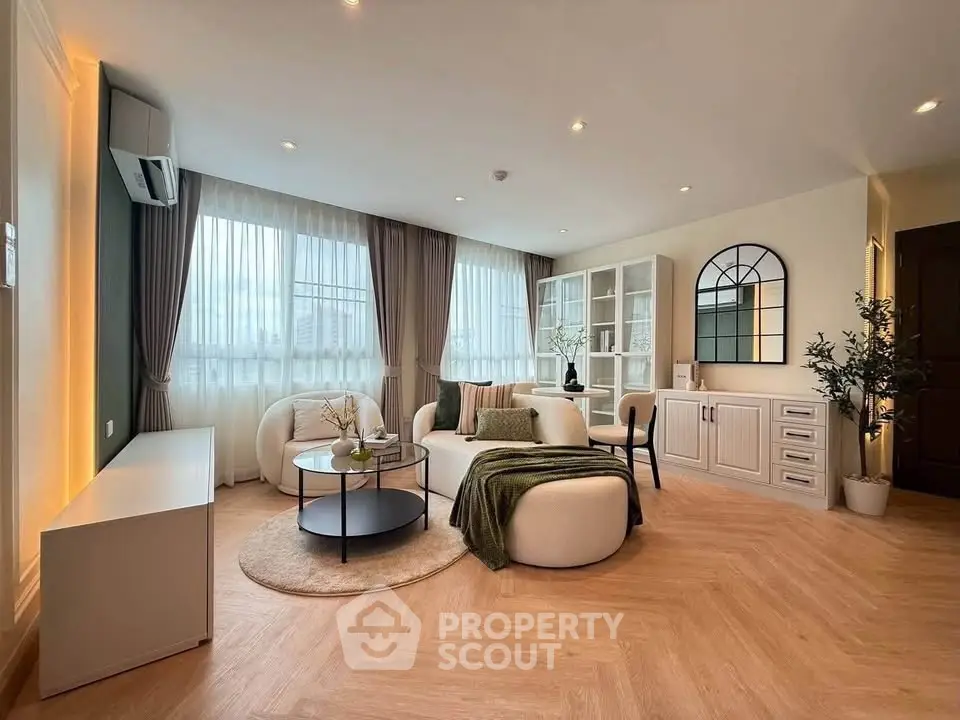 Spacious modern living room with elegant decor and natural light