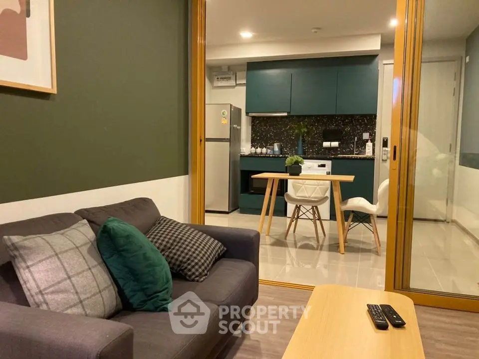 Modern open-plan living room with stylish kitchen and cozy seating area