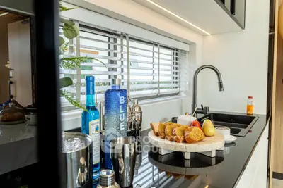 Modern kitchen with sleek black countertop and stylish decor