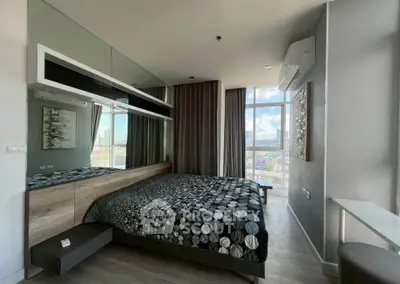 Modern bedroom with large window offering stunning city views, stylish decor, and contemporary furnishings.