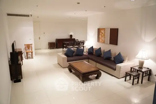 Spacious modern living room with elegant furniture and ambient lighting