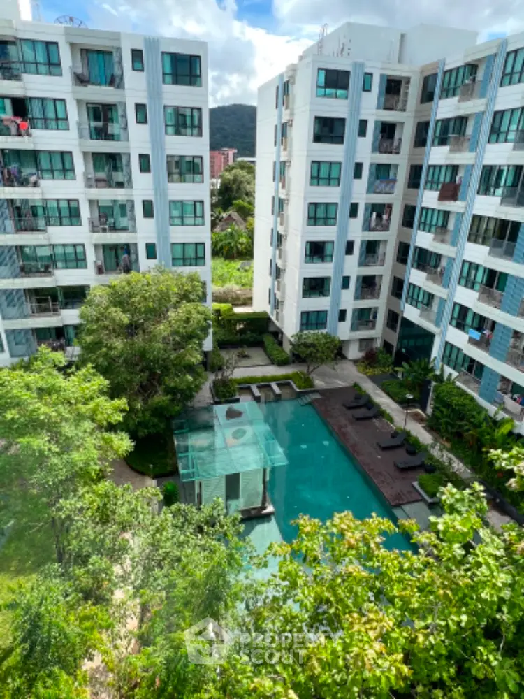 Modern condominium with pool view and lush greenery, ideal for urban living.