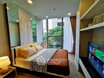 Modern bedroom with large window and stylish decor in urban apartment