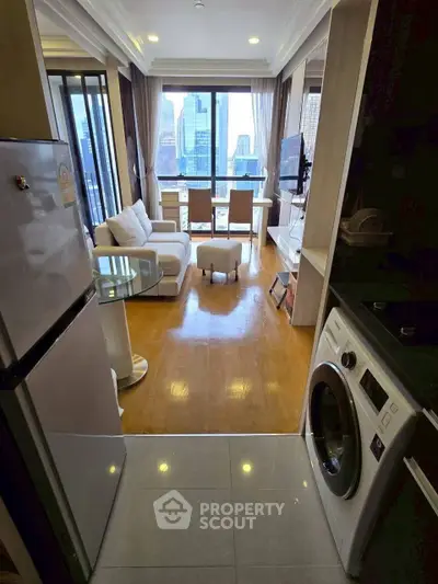 Modern living room with city view, featuring sleek furniture and in-unit laundry for urban convenience.