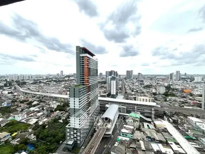 Stunning cityscape view from high-rise building showcasing urban skyline and modern architecture.