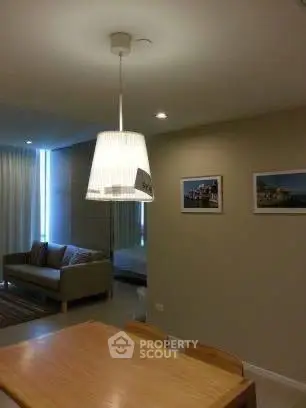 Modern living room with cozy seating and stylish lighting