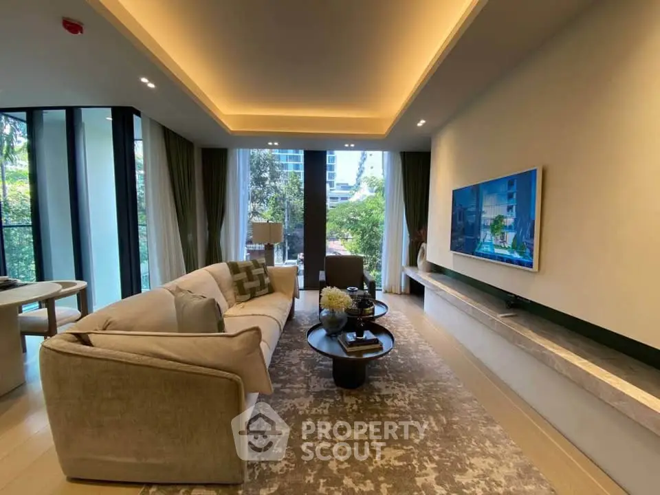 Luxurious living room with modern decor, large windows, and garden view in upscale apartment.