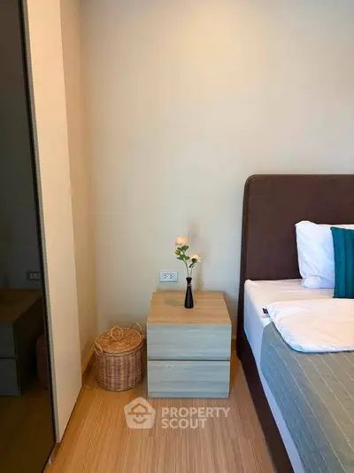 Cozy bedroom corner with modern nightstand and elegant decor