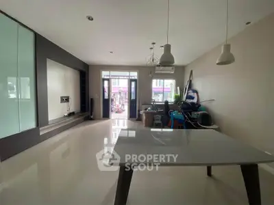 Spacious modern living room with sleek design and large windows for natural light.