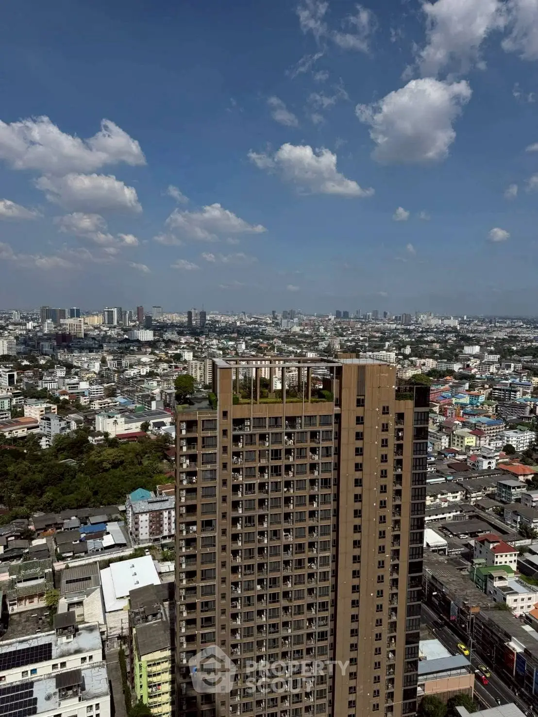 Stunning cityscape view from high-rise building with clear blue sky