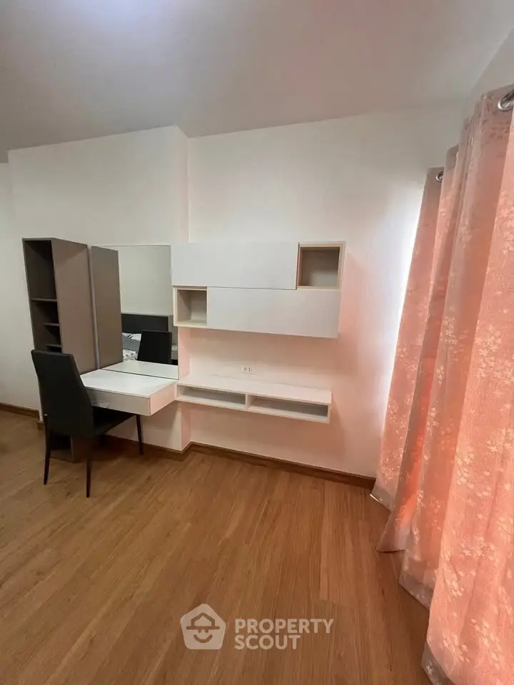 Modern study room with sleek desk and stylish shelving, perfect for productivity and organization.