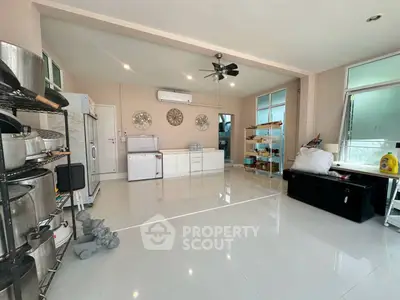 Spacious kitchen with modern appliances and open layout, perfect for culinary enthusiasts.
