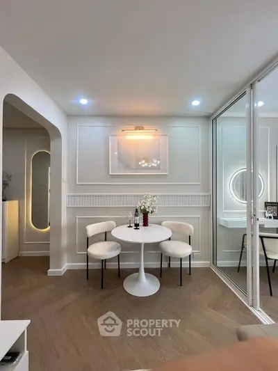 Elegant modern living room with stylish decor and cozy dining area, perfect for urban living.