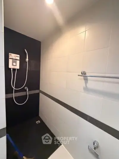 Modern bathroom with sleek shower design and tiled walls