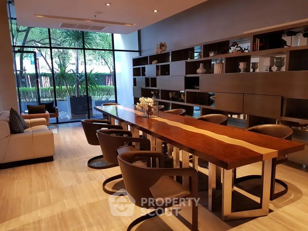 Luxurious modern living room with elegant wooden dining table and garden view, perfect for entertaining.