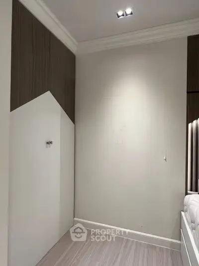 Minimalist bedroom corner with modern design and neutral tones
