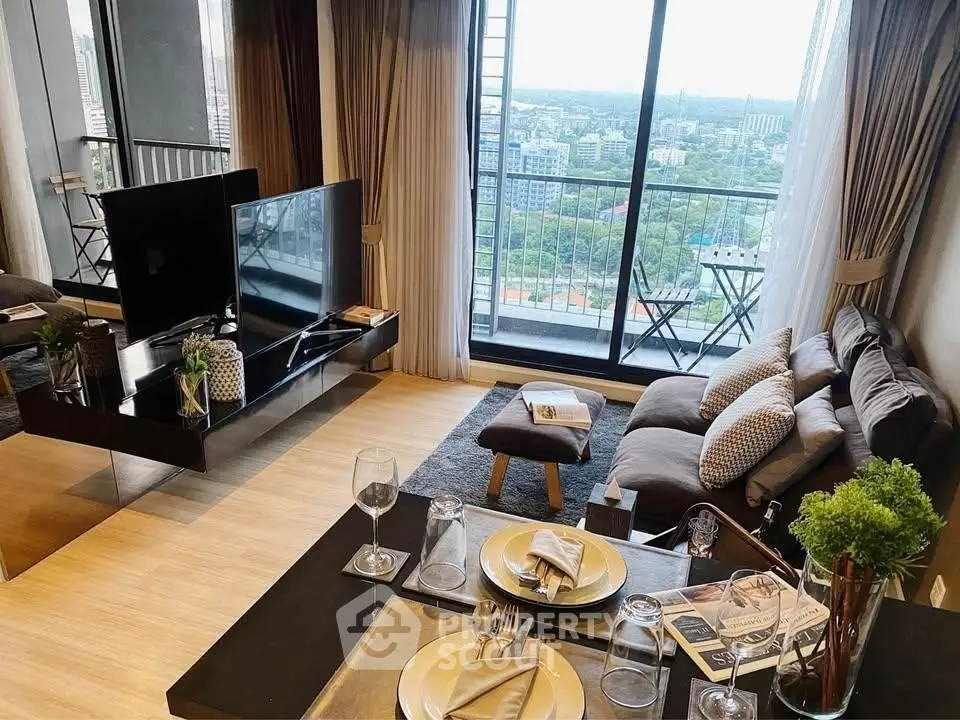 Modern living room with balcony and stunning city view, featuring elegant decor and cozy seating area.
