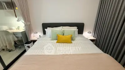 Cozy bedroom with stylish decor and comfortable bedding