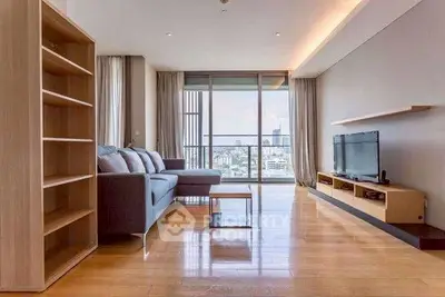 Spacious modern living room with city view and elegant wooden flooring.