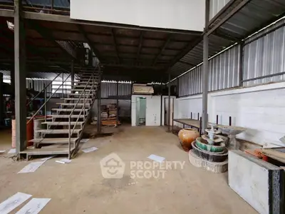 Spacious industrial warehouse with mezzanine and ample storage space