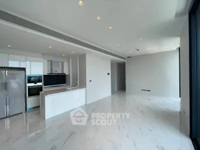 Spacious modern kitchen with sleek design and open layout in luxury apartment.