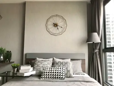 Modern bedroom with stylish decor and large window view
