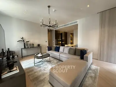 Luxurious modern living room with elegant decor and spacious seating area.