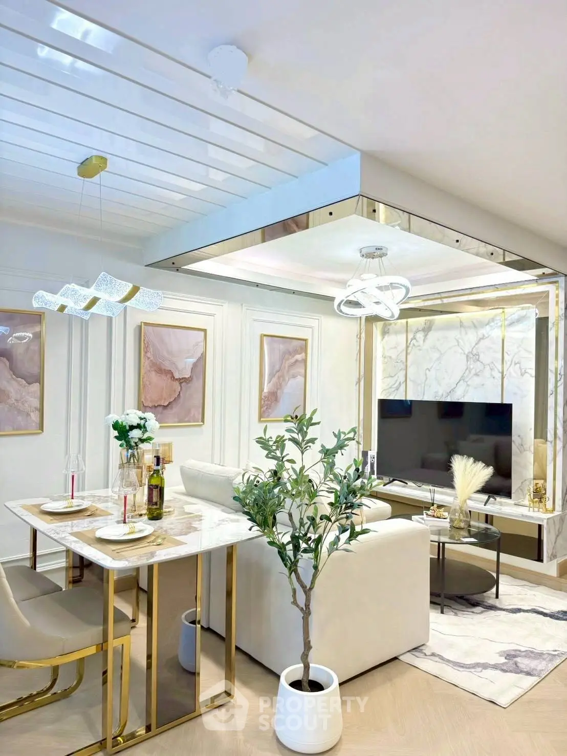Luxurious modern living room with elegant decor and stylish furniture, featuring a marble dining table and chic lighting.