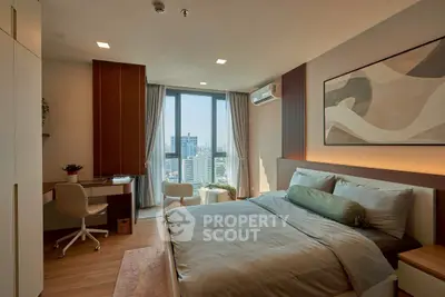 Modern bedroom with city view, stylish decor, and natural light.