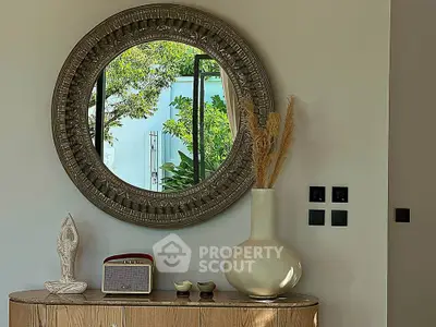 Stylish interior with decorative mirror and modern accents in a cozy living space.