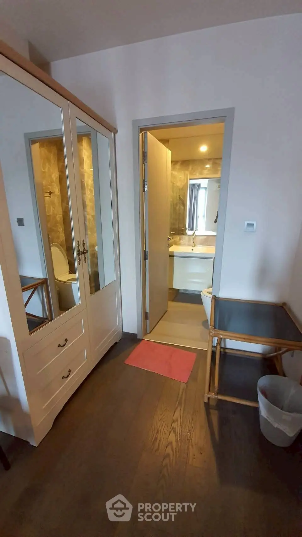 Cozy bedroom with ensuite bathroom and stylish wardrobe