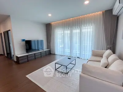 Spacious modern living room with elegant decor and natural light