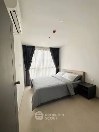 Modern bedroom with minimalist design and natural light