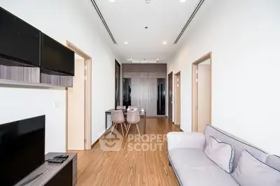 Modern living room with sleek furniture and wooden flooring