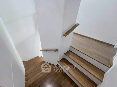 Modern wooden staircase with sleek design in a contemporary home
